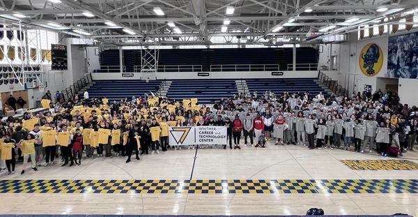 Large group photo of students with CTC banner